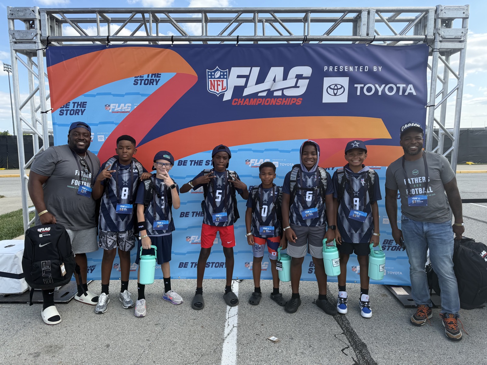 Frisco Elite players with their coaches at the NFL FLAG Championships