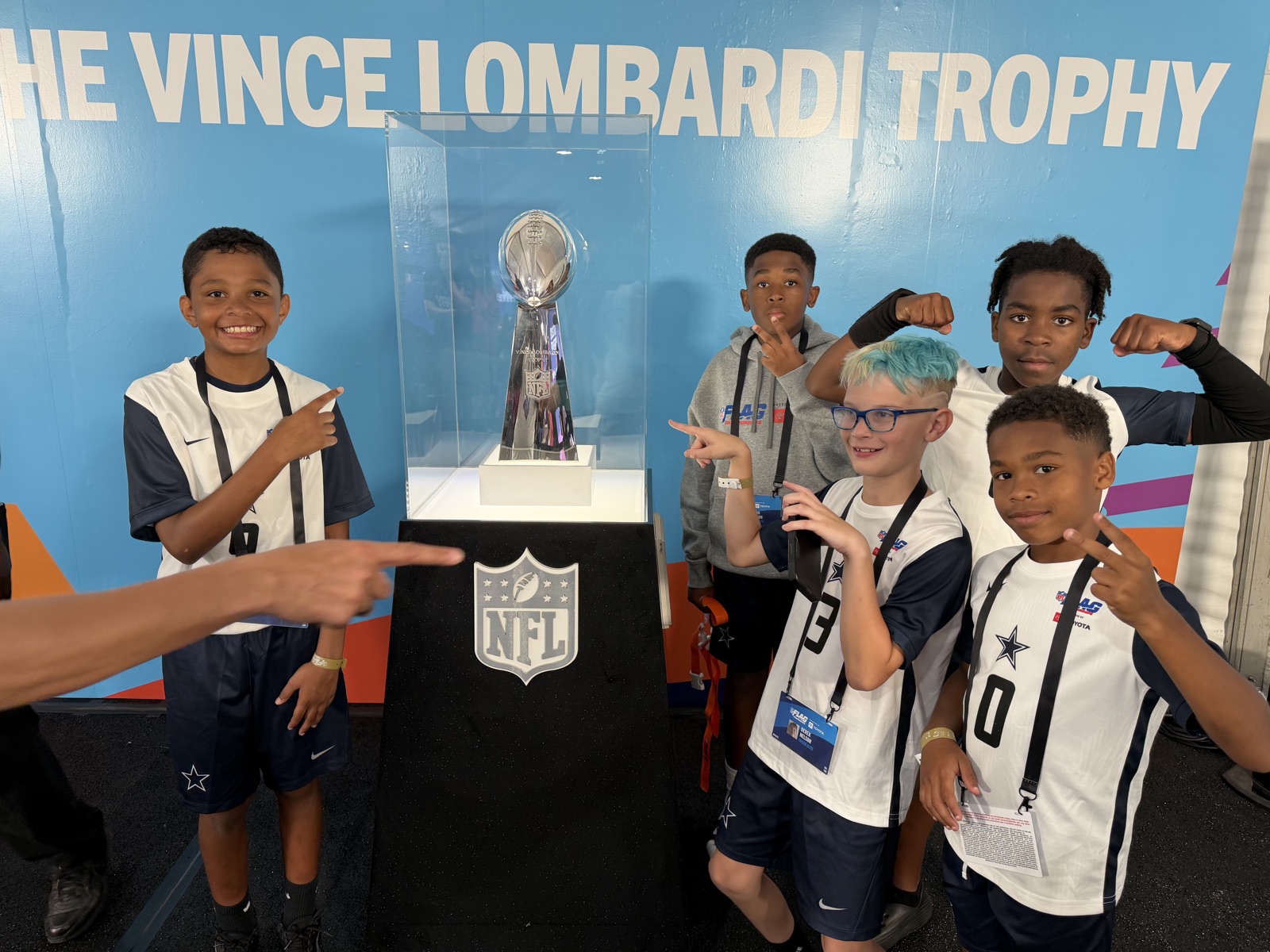Frisco Elite players with the Vince Lombardi Trophy at the NFL FLAG Championships in Westfield, Indiana