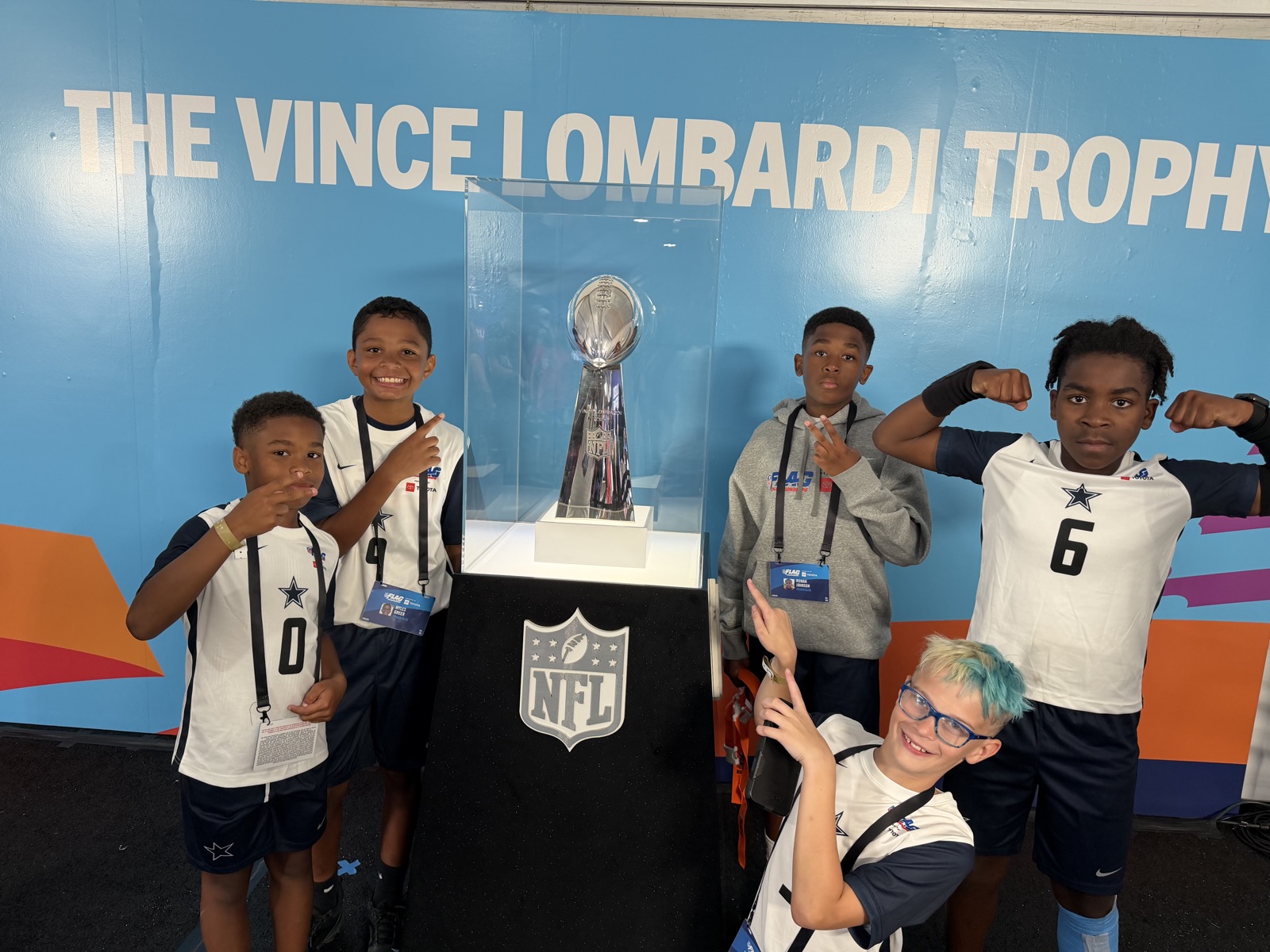 Frisco Elite players with the Vince Lombardi Trophy at the NFL FLAG Championships